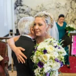 bride embraced by her father a few minutes before she gets married
