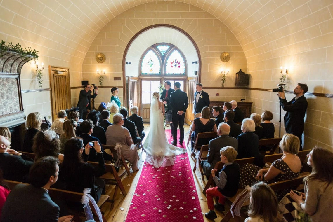 wedding ceremony in the chapel, wide angle view from the rear