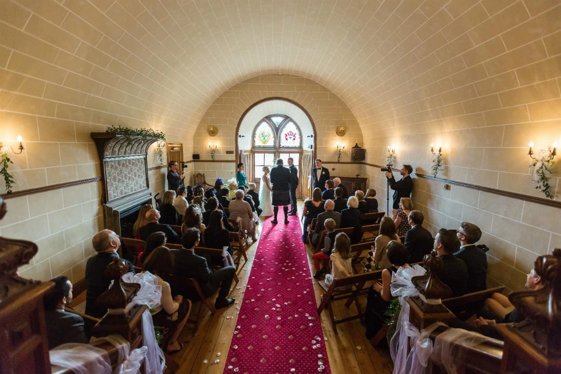 marriage ceremony in the chapel wide angle view from the rear