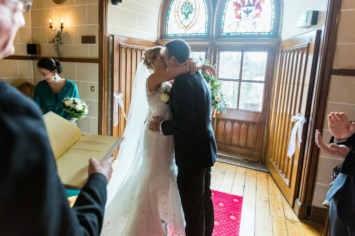 newlyweds' first kiss in the chapel