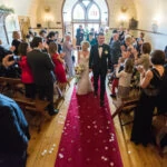 recessional from the chapel as newlyweds walk up the aisle