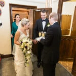 newlyweds are presented with a glass of prosecco after the ceremony