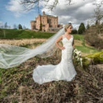 bridal veil flowing in the meadow in front of the castle