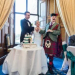 Piper Andrew Sharp congratulates the newlyweds in the Ramsay Suite