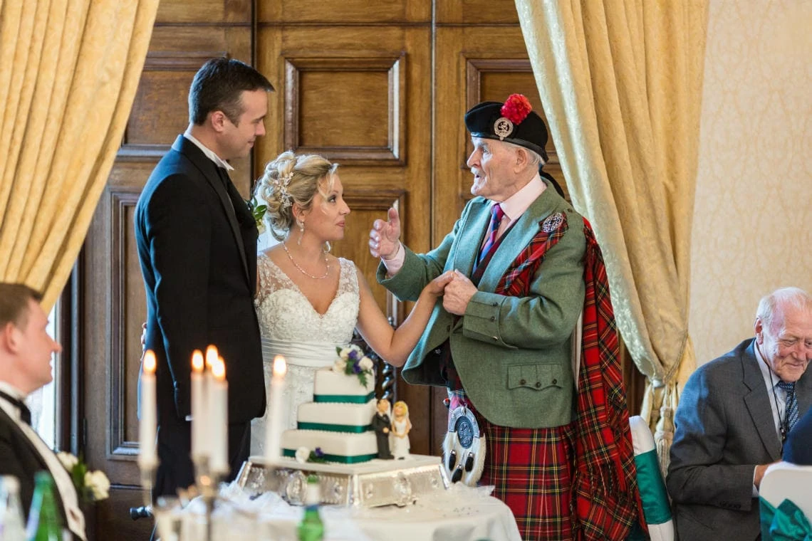 Piper Andrew Sharp offers advice and congratulations to the newlyweds in the Ramsay Suite