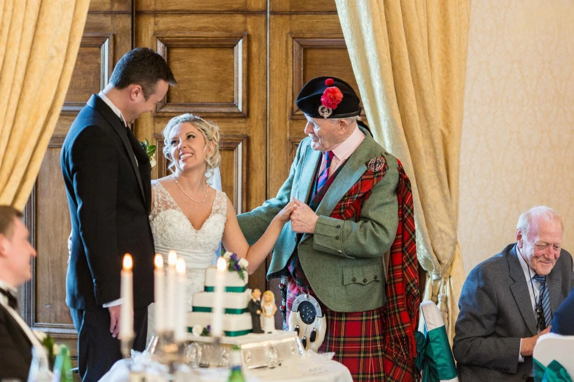 Piper Andrew Sharp offers advice and congratulations to the newlyweds in the Ramsay Suite