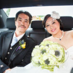 bride and her father sitting in the car to take them to Dalhousie Castle