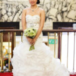 bridal full-length portrait as she waits to enter the chapel to get married