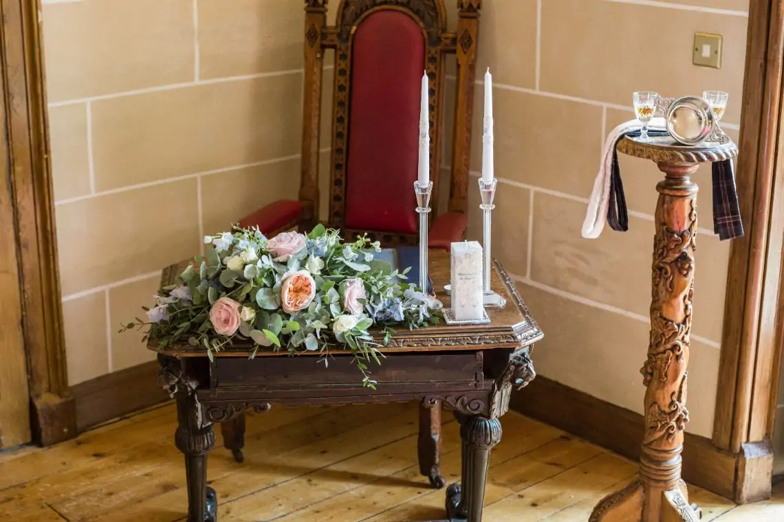 Table with flowers and candles in the Chapel.