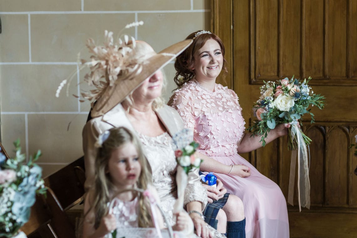 Mother of the bride, bridesmaid and flower girl in the Chapel.