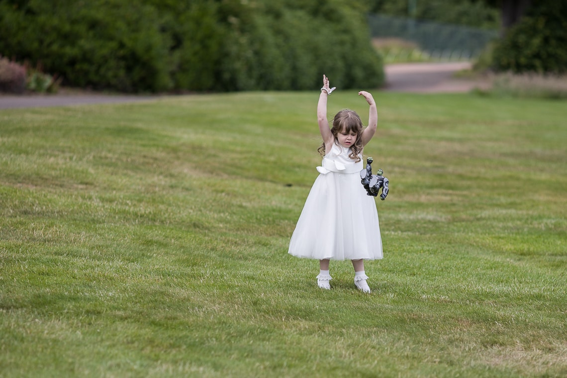 flower girl throws a toy