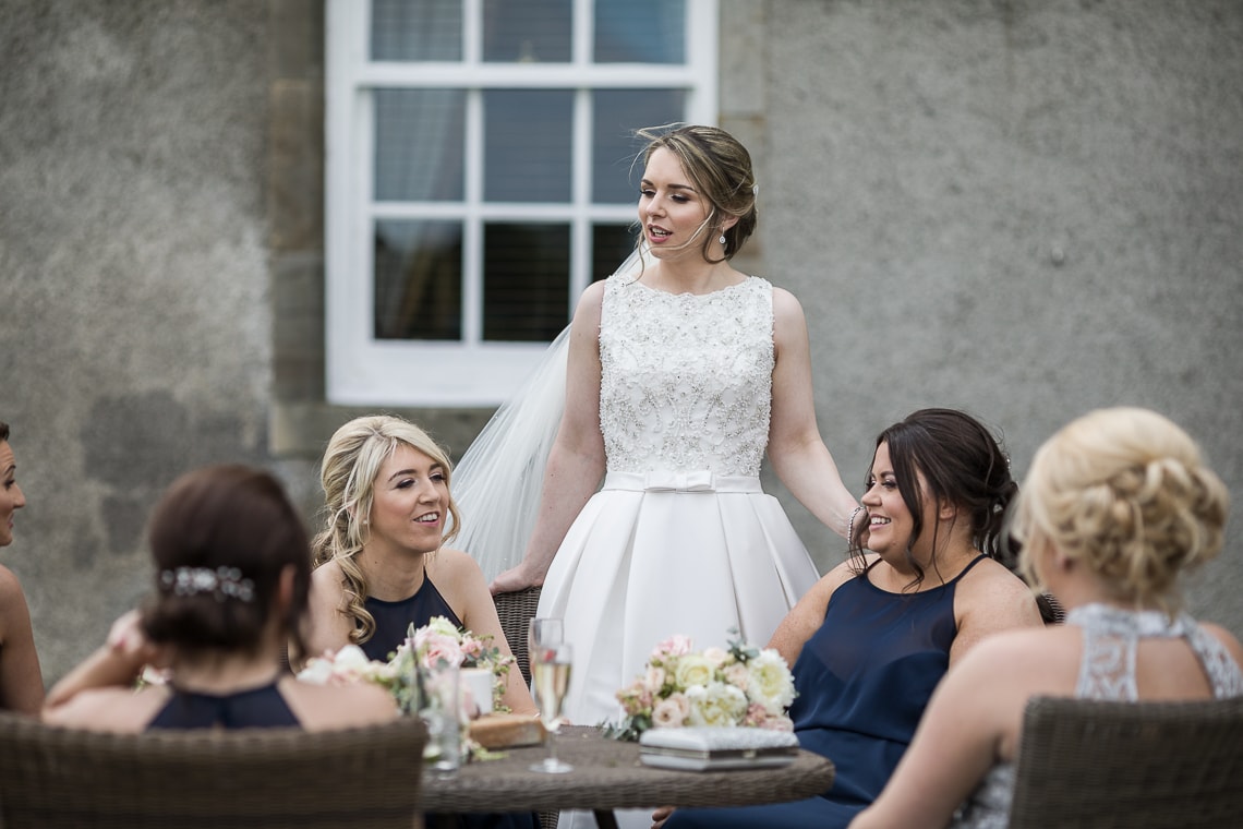 bride chatting to her bridesmaids