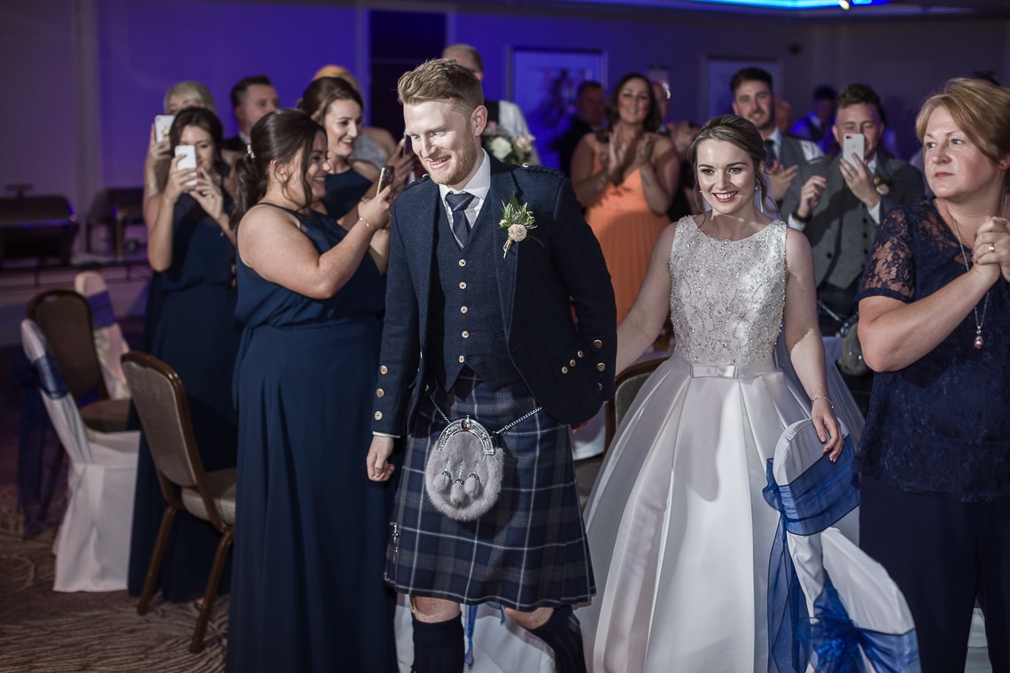 bride and groom make their way onto the dancefloor