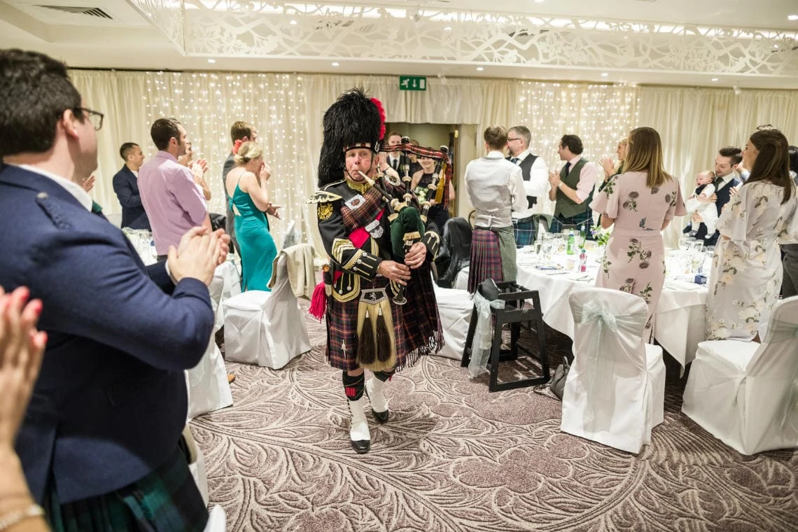 Dalmahoy Suite - piper leads the top table guests