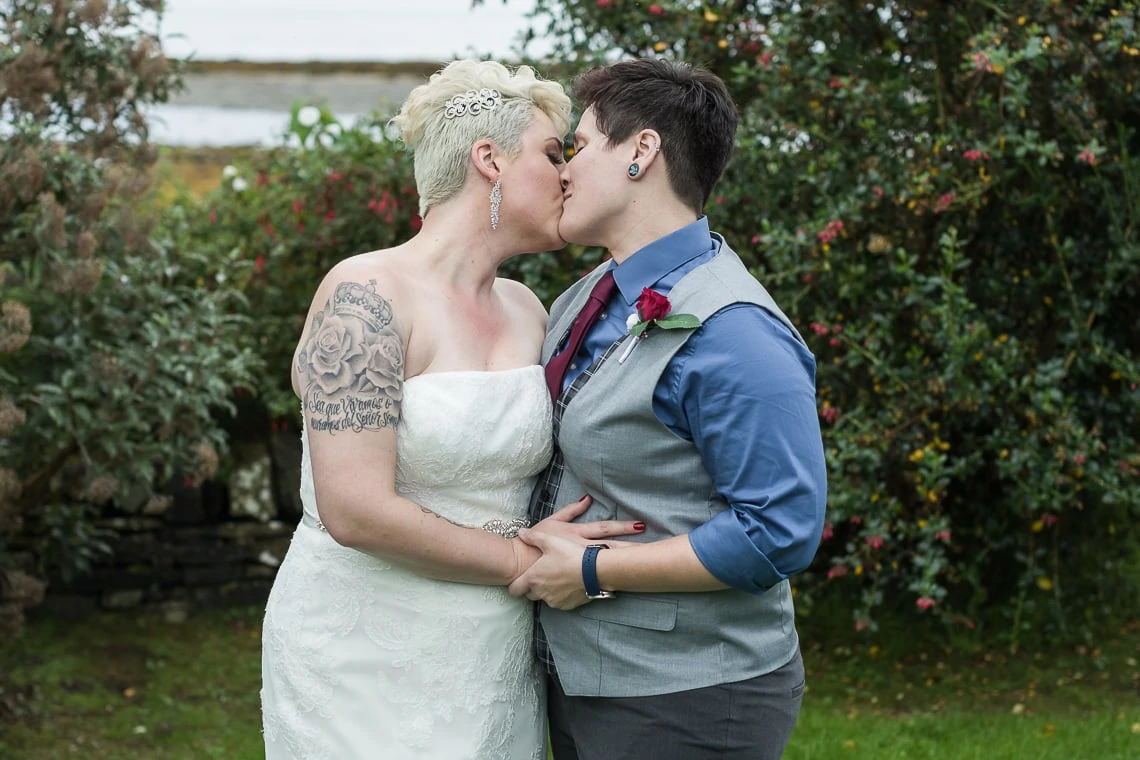 lesbian couple embrace pre-ceremony