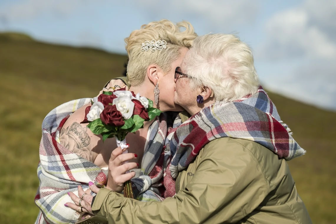 granny embraces granddaughter pre-ceremony