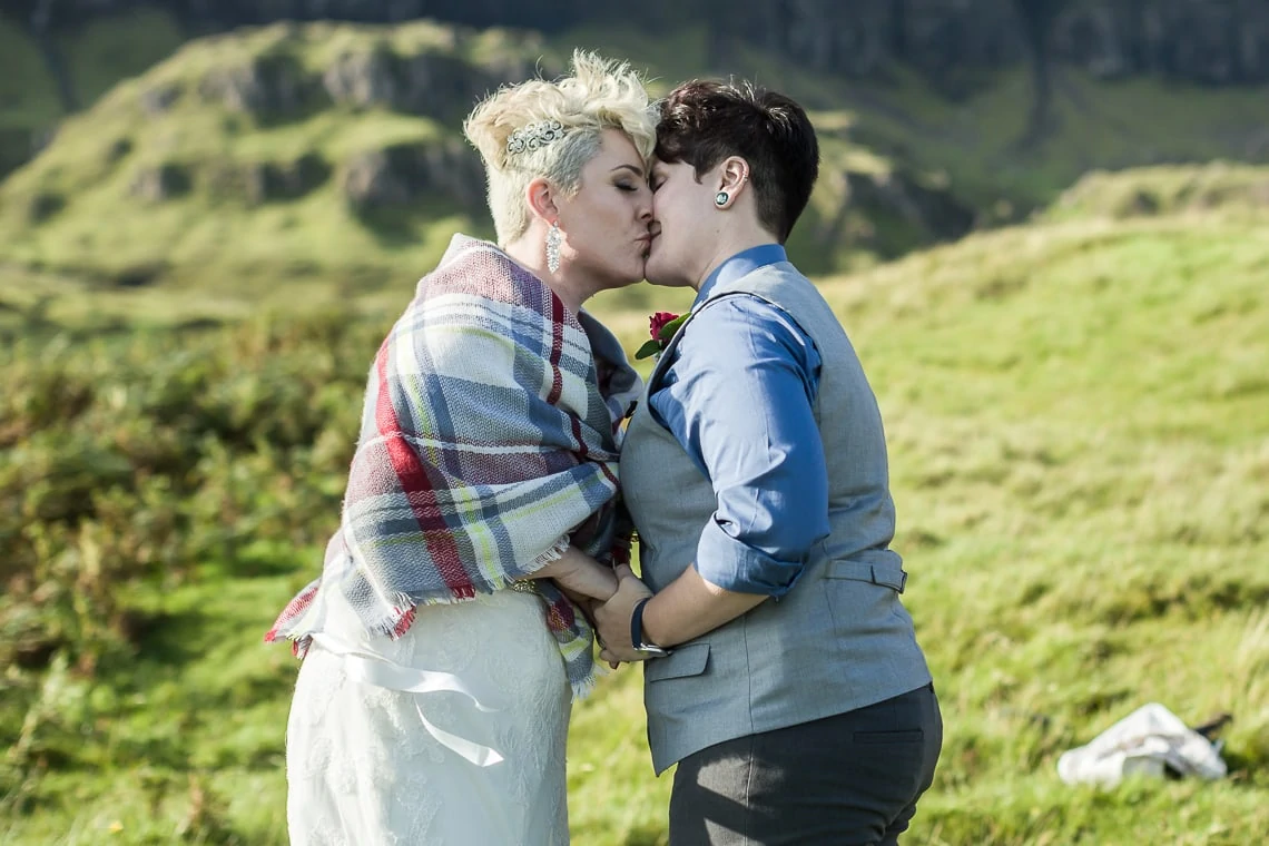 newly-wed lesbian couple embrace