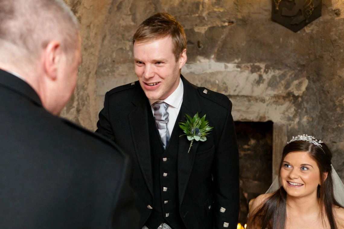 groom is congratulated in the Auld Keep