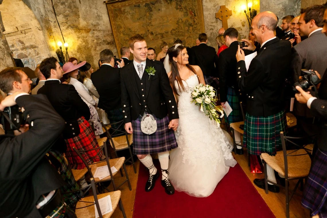 recessional of the newlyweds down the aisle of the Auld Keep