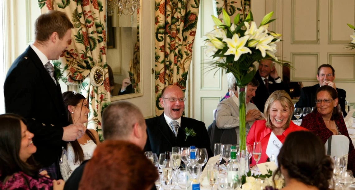 parents laughing as groom delivers his speech in The Croquet Room