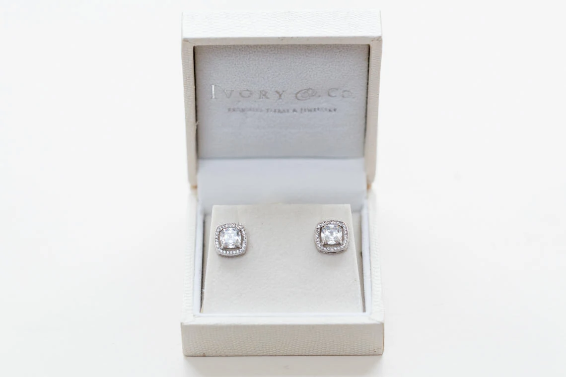 bride's Ivory and Co diamond earrings in a white box