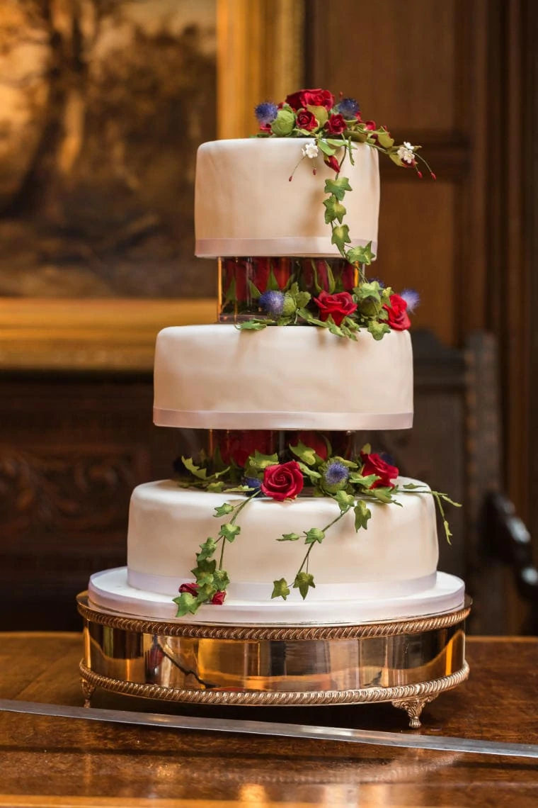 three-tier white wedding cake in the Main Hall