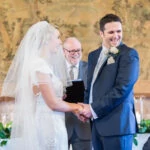 bride and groom laughing during Humanist ceremony in the Auld Keep