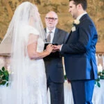 bride and groom exchange of rings during Humanist ceremony in the Auld Keep