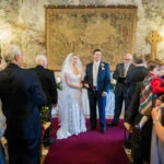 bride and groom tying the knot in the Auld Keep