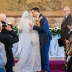 newlyweds' first kiss in the Auld Keep
