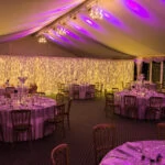The Pavilion set up in the evening for the wedding reception with LED curtain in the background