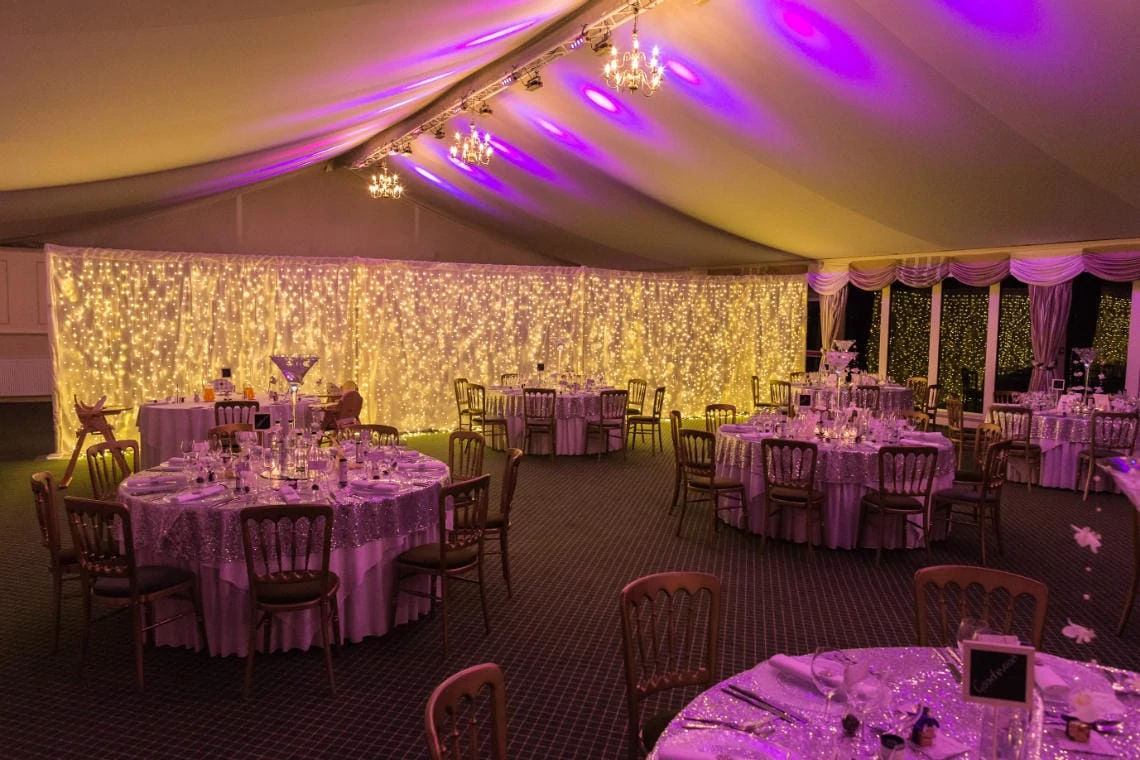 The Pavilion set up in the evening for the wedding reception with LED curtain in the background