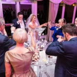 top table guests raise a toast to the newlyweds The Pavilion
