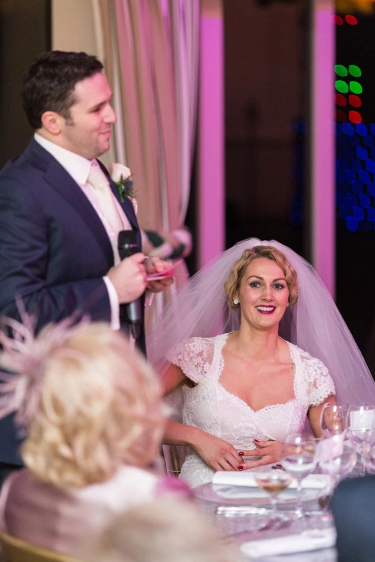 bride smiling during her groom's speech in The Pavilion