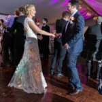 evening reception with newlyweds and guests dancing in the Pavilion