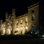 Dundas Castle exterior lit up in the evening
