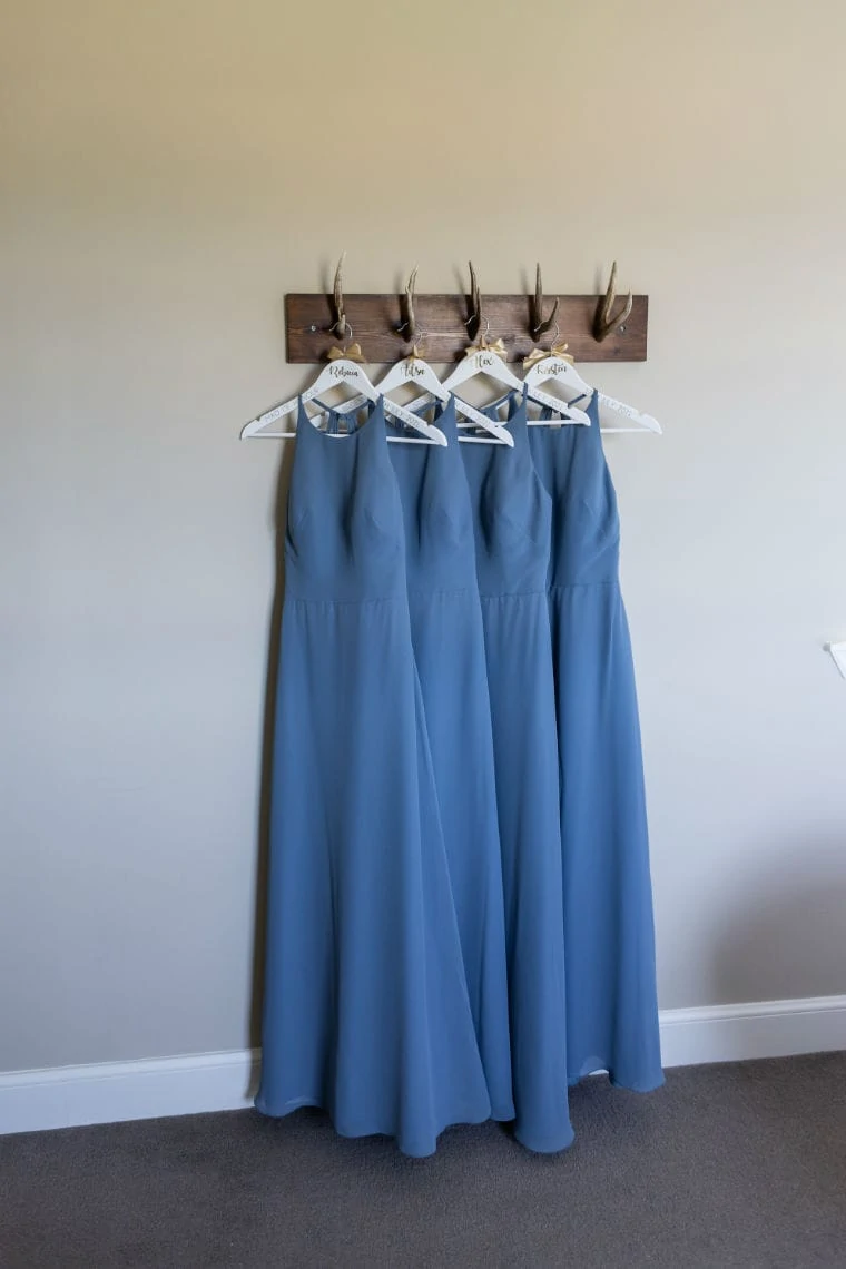 pale blue bridesmaids dresses hanging up
