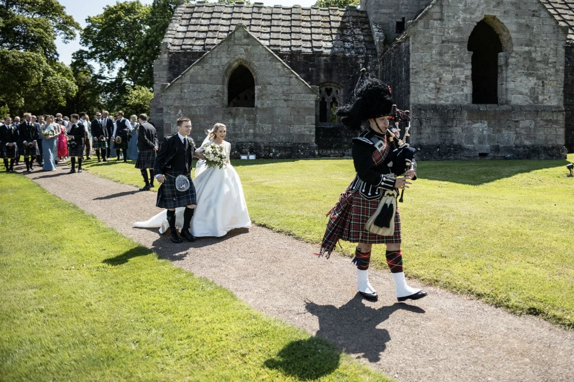 piper leads newlyweds to the Pavilion
