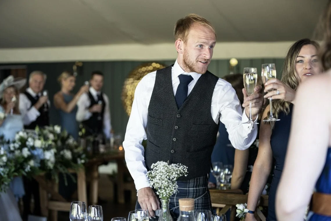 guests toast the newlyweds