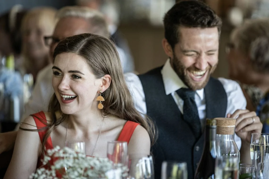 guests laughing during the speeches