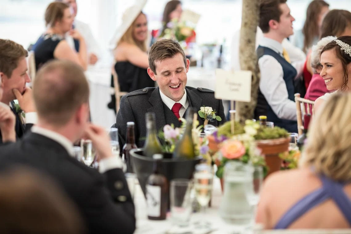groom laughs during the father of the bride speech
