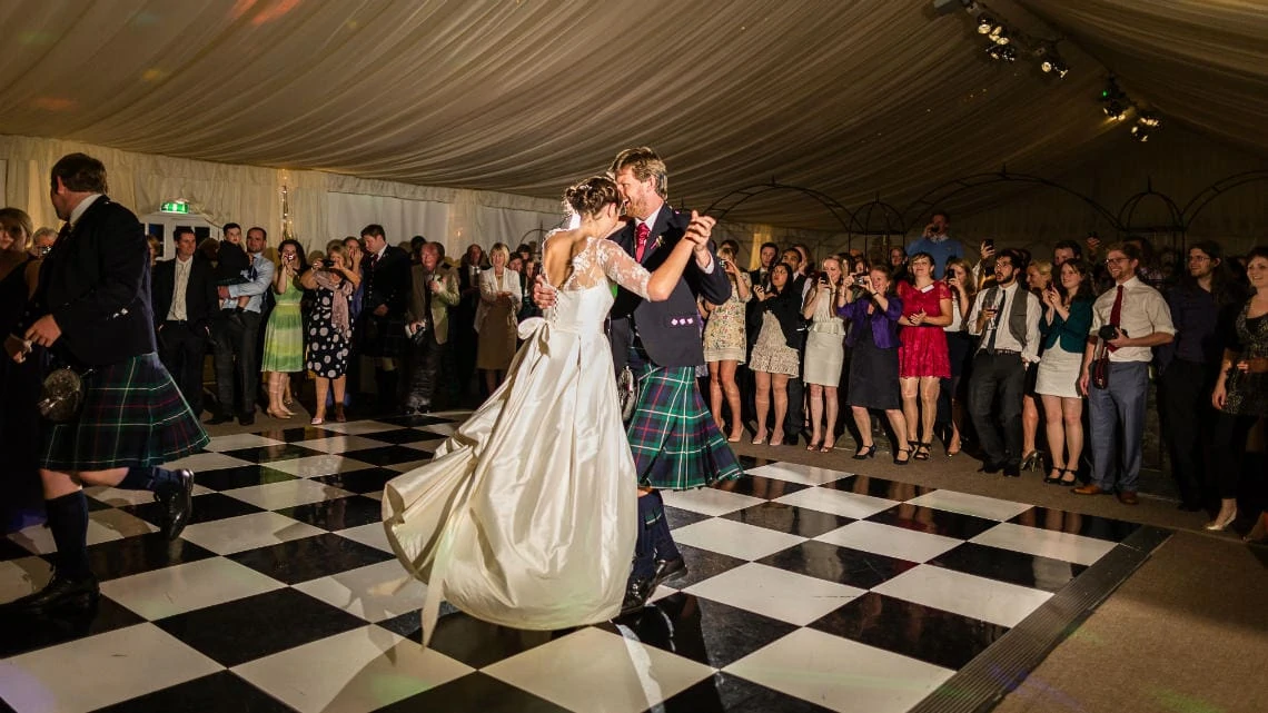 newlyweds on the dancefloor of the marquee during the first dance