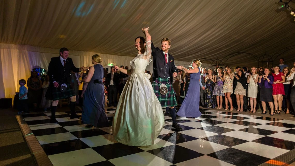 bride and groom dancing in the marquee