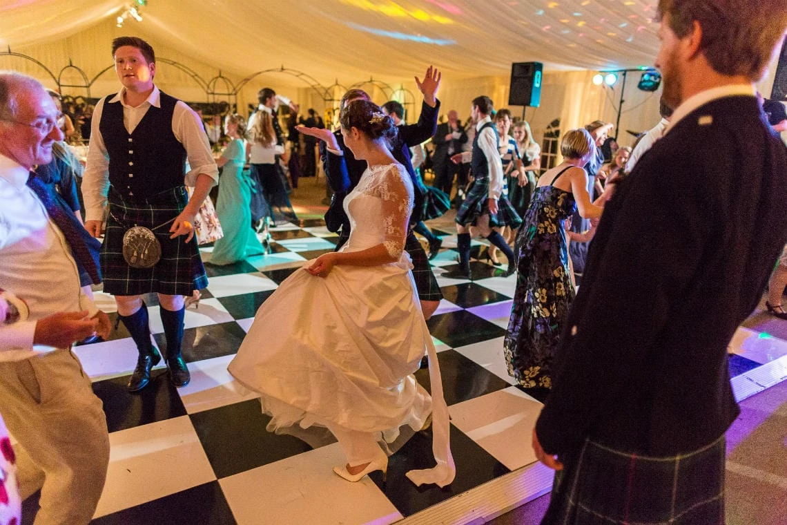bride dancing in the marquee during the ceilidh