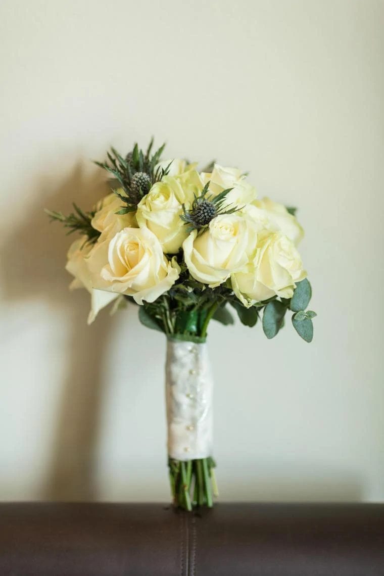 bridal bouquet yellow roses with blue thistles
