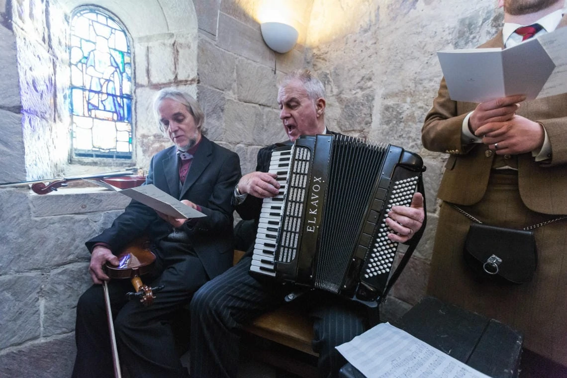 accordion player during wedding ceremony in St Margaret's Chapel