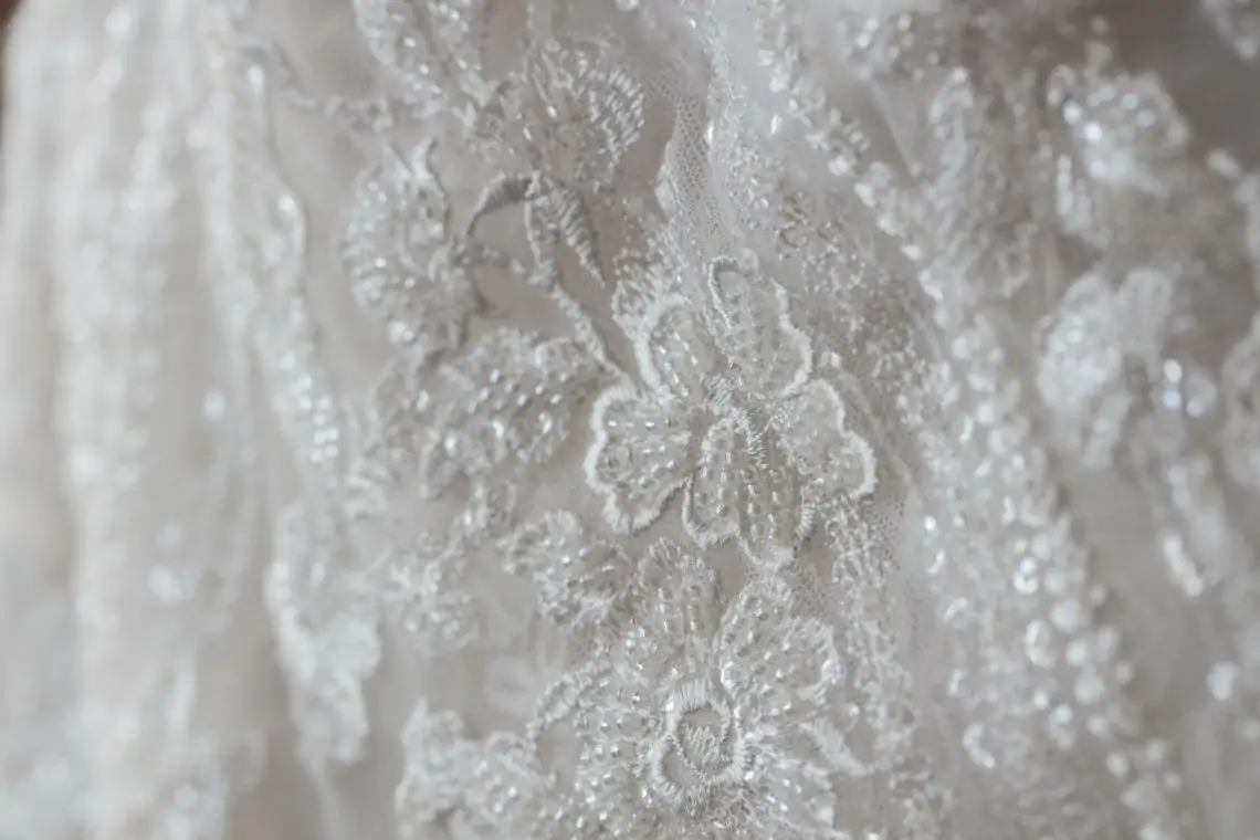 Close up photo of detailing on Morilee bridal gown by Madeline Gardner