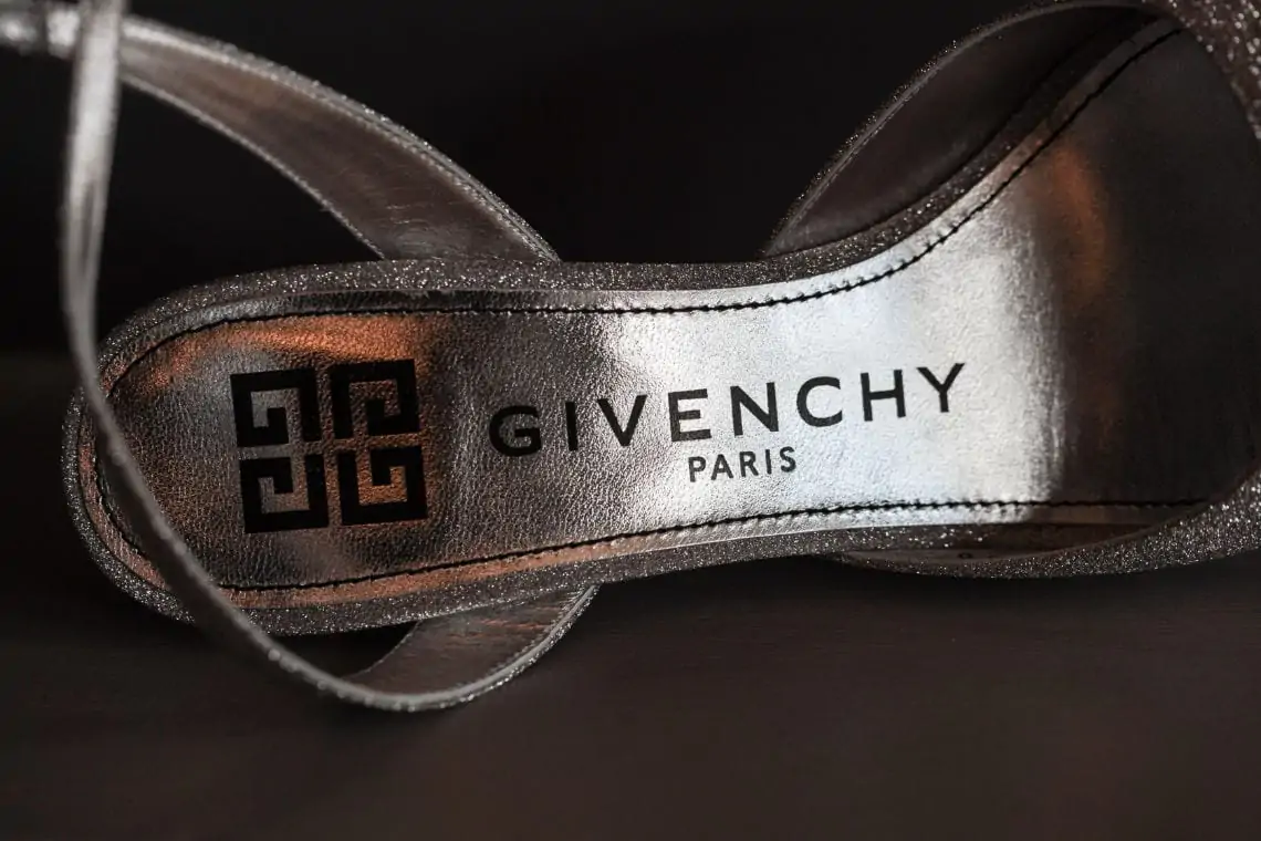Close up of Givenchy name on silver shoes