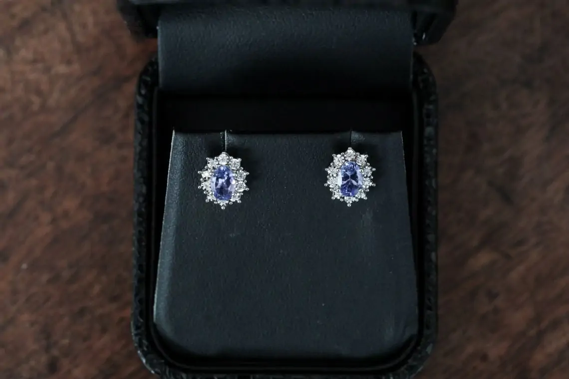 Diamond and sapphire earrings in a black box
