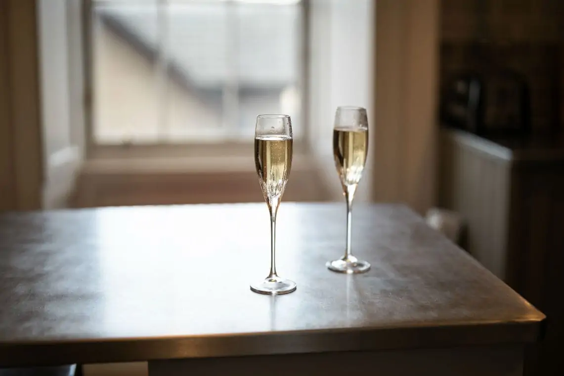 Two champagne flute glasses filled with champagne